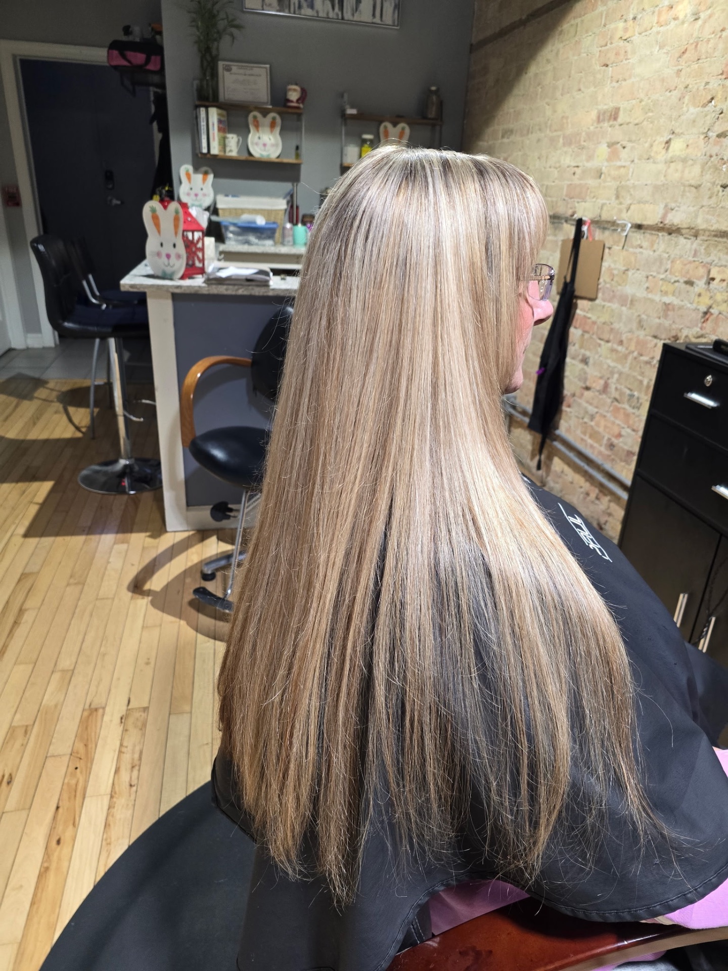 Long dimensional blonde highlights at Studio K Lockport IL