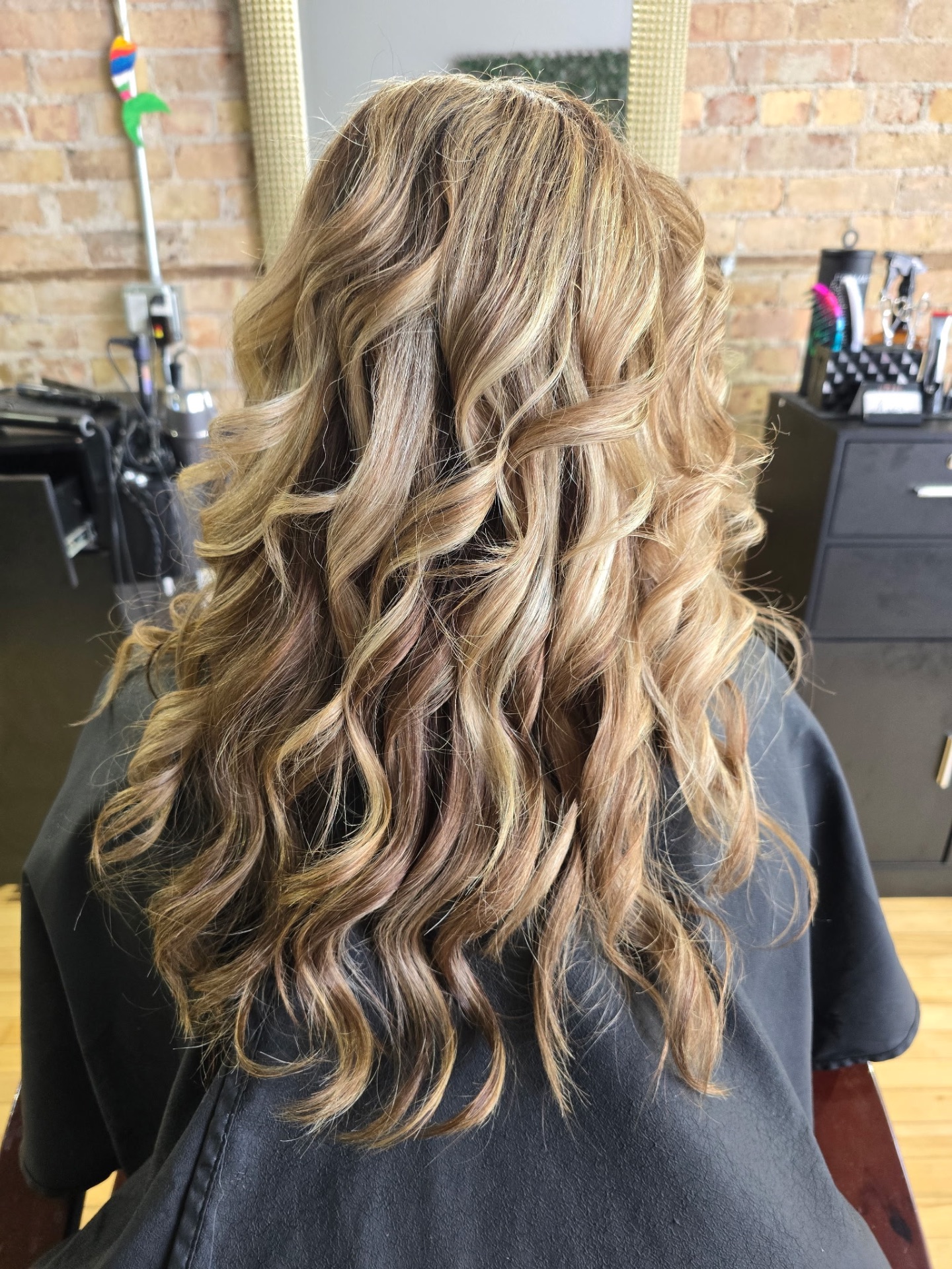 Honey balayage with soft beachy waves by Studio K Hair Studio Lockport IL