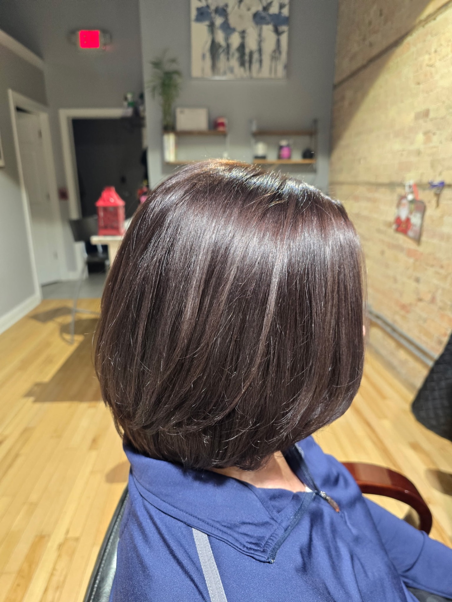 Sleek dark brunette bob haircut at Studio K Lockport IL